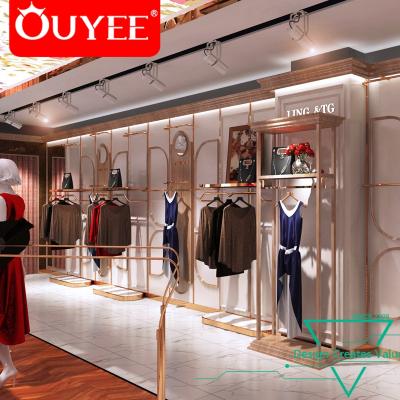 China Lady Clothes Shop Gold Garment Rack Gondola Lady Clothes Shop Layout Glass Showcase Cabinet for sale