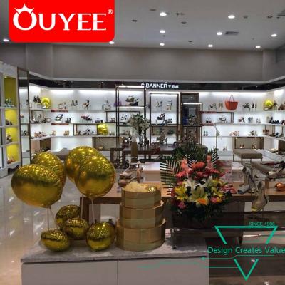 China Shoe Shop Fashion Wall Shelving Store Decoration Shoe Display Ideas Modern Design Shoe Counter Shoes Bag Store Decoration for sale