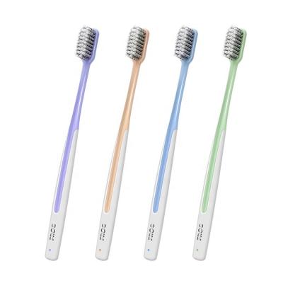 China Spiral Stiffens 0.01mm FROG Activated Charcoal Home Soft Bristle Adult Toothbrush With Flat Plastic Handle Eco-Friendly Toothbrushes for sale