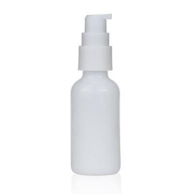 China Personal Care 1oz 30ml Opal White Ceramic Boston Round Pump Glass Bottle for sale