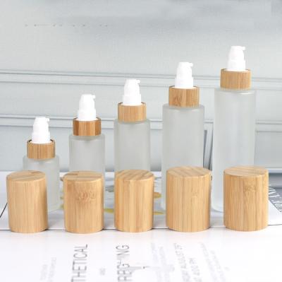 China Personal Care 30ml 50ml 60ml 80ml 100ml 120ml Cylinder Shape Lotion Pump Glass Frosted Bamboo Bottle for sale