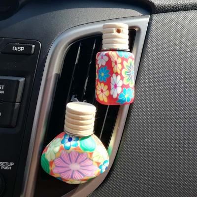 China 8-12ml Car Vent Perfume Bottle Polymer Clay Floral Print Car Air Cosmetic Freshener for sale