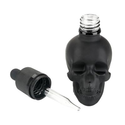 China Personal Care Black Glass Scrub Skull Bottle Bitter Perfume Bottles 30/60/120ML Dropper Bottle for sale