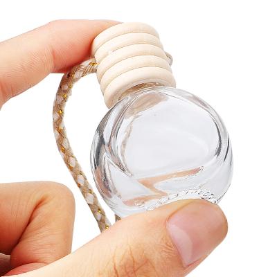 China 6ml Personal Care Car Perfume Bottle Hanging Glass Empty Car Ornaments Air Freshener Container For Essential Oils Perfume Pendant for sale