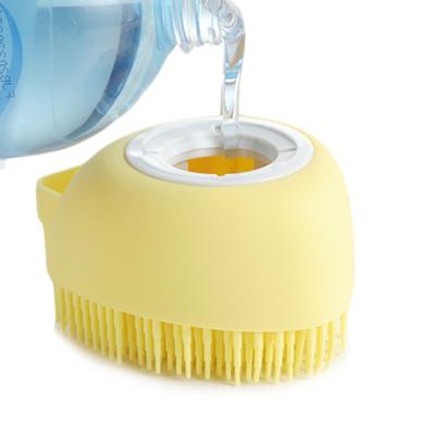 China Sustainable Dog Cat Shampoo Dispenser Pet Bath Brush Comb Silicone Grooming Dispenser for sale