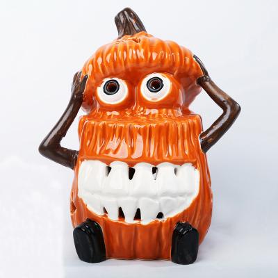 China Handmade Wholesale Desktop Decoration Ceramic Halloween Pumpkin Lantern For Bar for sale