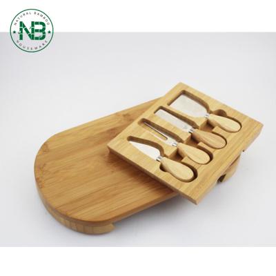 China Sustainable Oval Creative Bamboo Cheese Cutting Board With Utensils Cheese Tool Kit for sale