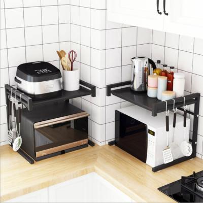 China Carbon Steel Kitchen Storage Rack Stocked Standing Type Microwave Oven Rack Retractable Microwave Oven Stand for sale