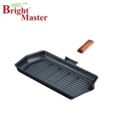 China Durable Non-Stick Carbon Steel Rectangular Grill Pan With Wooden Handle for sale