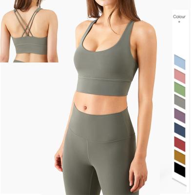 China Custom logo lulu fitness crop top breathable padded woman sexy nude cross back sports women plus size yoga bra for sale