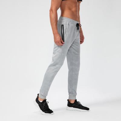 China Men Workout Jogger Pants Gym Fitness Training Trackpants Winter Slim Fit Comfortable Workable Autumn Loose Sweatpants With Zipper Pockets for sale