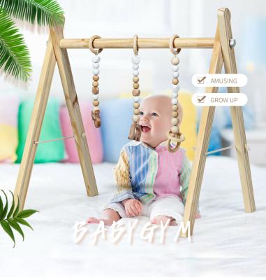 China Eco-Friendly Wholesale Organic Collapsible Baby XIHA Gym Frame Wooden Activity Game Toy for sale