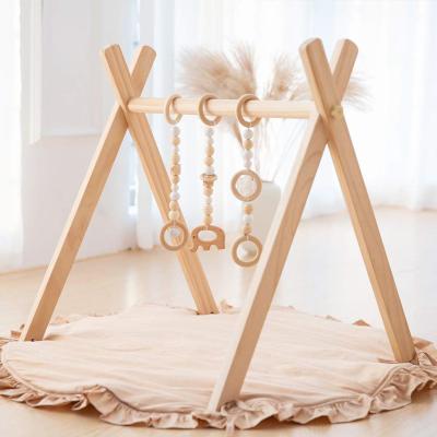 China XIHA Soft Wholesales Beech Wood Baby Teether Toys Activity Foldable Gym Frame Gym Game Hanging Baby Bar Newborn Gift for sale