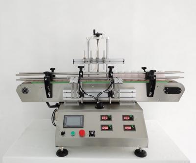 China Food Filling Machine Four Heads Automatic Water Essential Oil Pump Desktop Liquid Magnetic Filling Machines for sale