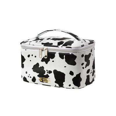 China Hot Sale Fashion Cows Pattern Portable Waterproof PU Makeup Storage Cosmetic Bag Set With Zipper Toiletry Bags For Travel for sale