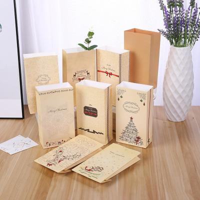 China Recyclable Custom Stock Exquisite Merry Christmas Gift Wrapping Paper Bag Window Gift Bag for sale