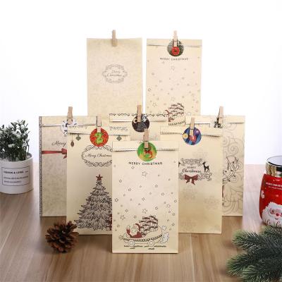 China Recyclable Merry Christmas giftNew Custom Stock Design Recycle Kraft Paper Christmas Gift Bag For Shopping for sale