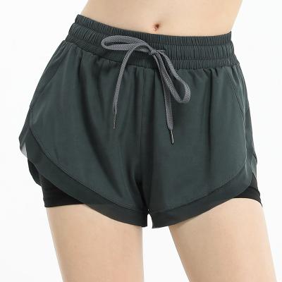 China Breathable Anti-fake Slim Sports Pocket Women's Yoga Fitness Shorts And Quick-drying Loose Two-piece Outdoor Running Pants for sale