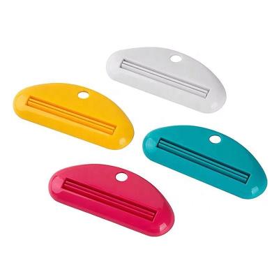 China Multi Viable Colors Toothpaste Tube Squeezer Toothpaste Holder Squeezer Toothpaste Holder Seat Holder Dispenser For Bathroom Use for sale