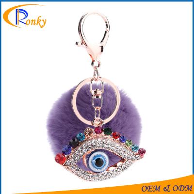 China Custom Decoration Novelty Gifts Key Chain For Sale Evil Eye Charms Fur Ball Key Chain for sale