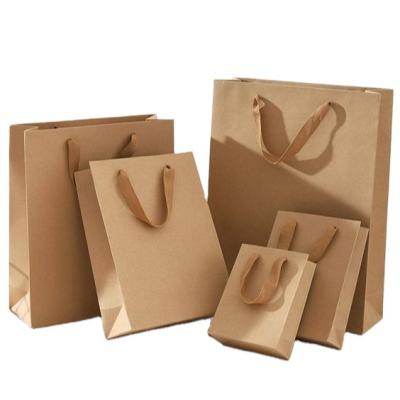 China Modern Wholesale Custom Logo And Printing Small Paper Bag Shopping Bag Brown Small Gift Bag for sale