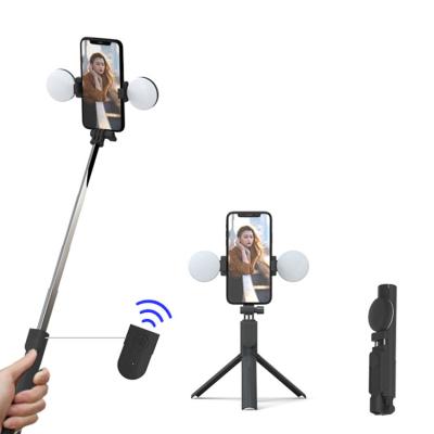 China Selfie 360 ​​Rotation Wireless Control Portable Smart Selfie Stick Tripod With Dual Led Fill Light for sale