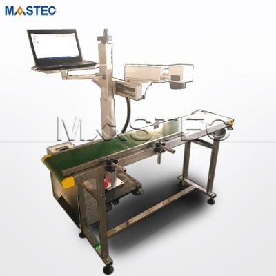 China Laser Marking 20W 30W 50W 70W 100W Driving Laser Marking Machine With Conveyor Belt for sale