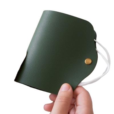 China Durable dustproof double-sided PU environmental protection storage leather bag folding waterproof mask storage clip for sale