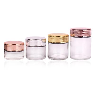 China Wholesale Skin Care Cream Round Shaped 1oz 2oz 3oz 4oz Clear Glass Jars With Child Resistant Plastic Lid for sale