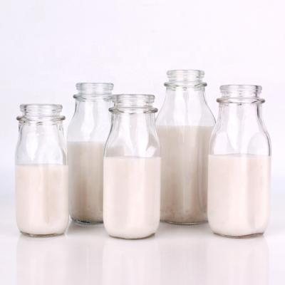 China Wholesale 240ml 280ml 16oz 1000ml Square Beverage Clear Milk Glass Bottle With Lid for sale