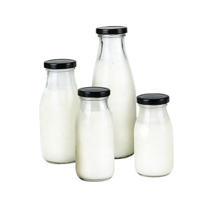 China 300ML Beverage Milk Glass Empty Clear Bottle With Screw Hook Cap for sale