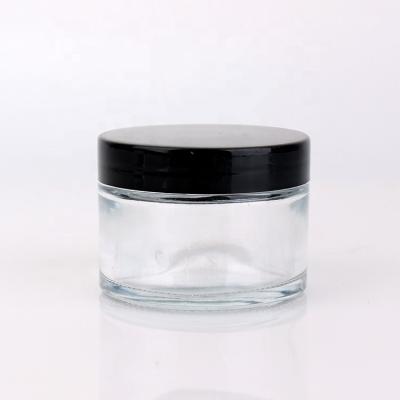 China 100ml Skin Care Cream Round Clear Glass Face Cream Cosmetic Cream Jars With Lid for sale