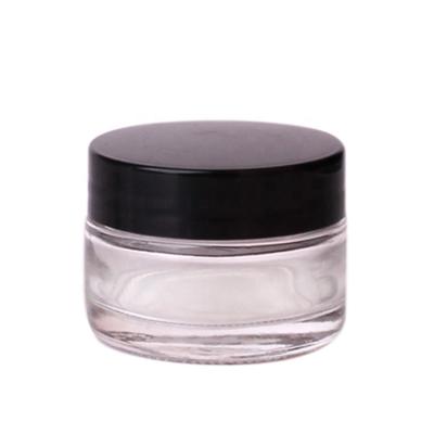 China Clear 50ml Wide Mouth Glass Cosmetic Jars Cosmetic Container With Black Lids For Powders And Ointments for sale