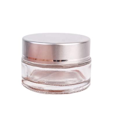 China Skin Care Cream Jars 20ml Transparent Cosmetic Glass Containers With Silver Lid for sale