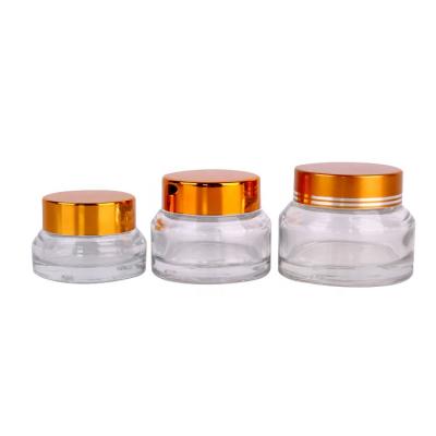 China Eco-Friendly Recyclable Set 3 Pack Round Empty Glass Cream Jar With Black Lid Cosmetic Refillable Empty Glass Container for sale