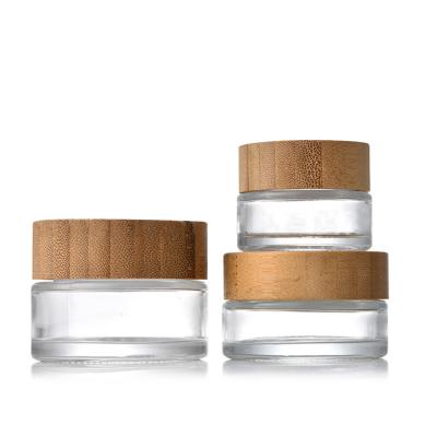 China Personal Skin Care Packaging Fancy 20ml 50ml 100ml Eco-Friendly Bamboo Lid Container Glass Cosmetic Jar For Face Body Cream Packaging for sale