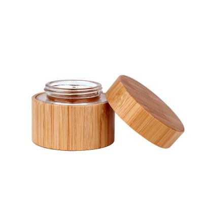 China Environmental friendly natural bamboo jar packaging face cream glass bamboo cosmetic jar with bamboo lid for sale