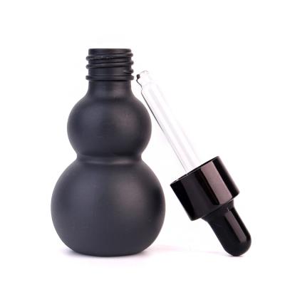 China Personal Care 30ml Calabash Shape Essential Oil Cosmetic Packing Glass Bottle With Dropper for sale