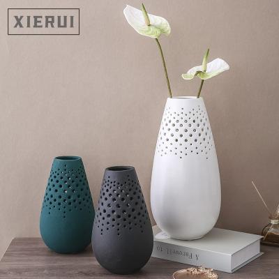 China Flower Vase Modern Minimalist Luxury Nordic Ceramic White Vase For Home Decor Nature Nature Rough Matte Hollow Vase for sale