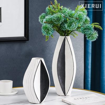 China Simple Modern Minimalist Creative Luxury Ceramic Vase Bud White Nordic Textured Geometric Vase For Home Decor for sale