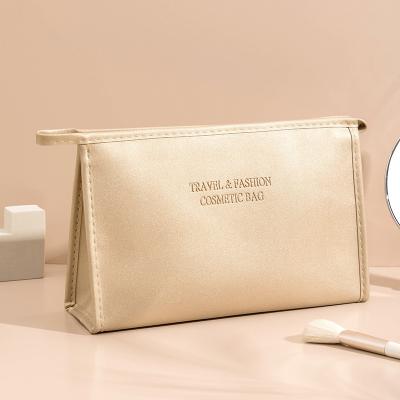 China Lady high quality gold makeup bag with logo makeup packaging bag summer makeup bag for sale