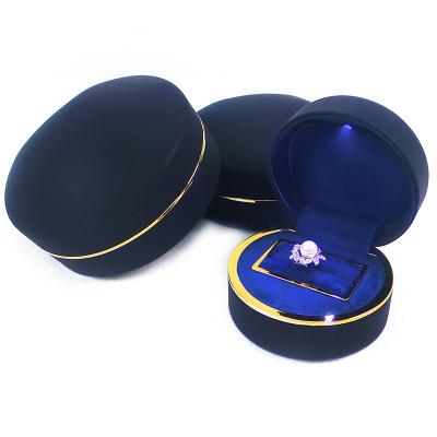 China Hot Custom Logo Jewelry Organization PU Leather Jewelry Ring Box With LED Light for sale