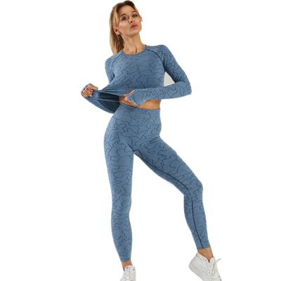 China Breathable Latest Yoga Fitness Set Seamless Curve Hollowed-out Sports Long Yoga Two Piece Set for sale