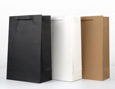 China Recycled Materials Cheap Wholesale Brown Kraft Paper Bag With Handles For Shoes And Clothing for sale