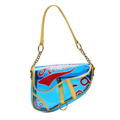 China 2021 newest durable transparent saddle bag for women PVC plastic personality printed large capacity ladies fashion handbags for sale