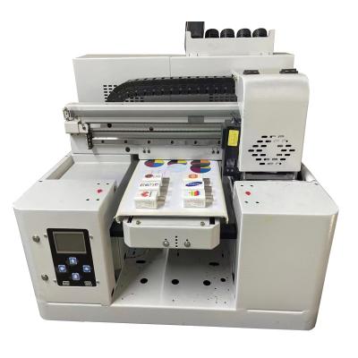 China Hotels Flatbed 4060 UV DTF printer printing label /logo AB film ,Ceramic, glass, acrylic,wood,metal,leather,phone case for sale