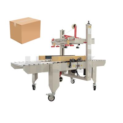 China HZPK 2600 Small Automatic Food Glue Carton Box Tape Plastic Paper Adhesive Machine 400*300mm 20M/MIN 90*80mm for sale