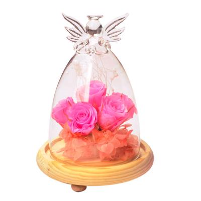 China Folk Art Plant Enternal Flower Glass Dome With Angel On Top With Wooden Base for sale