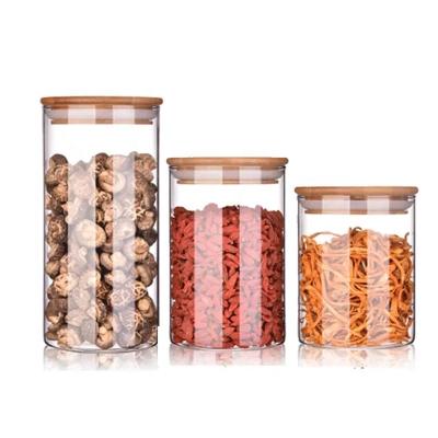 China Art Decor Kitchenware Clear Glass Spice Jar Storage Durable Glass Jar With Wooden Lid for sale