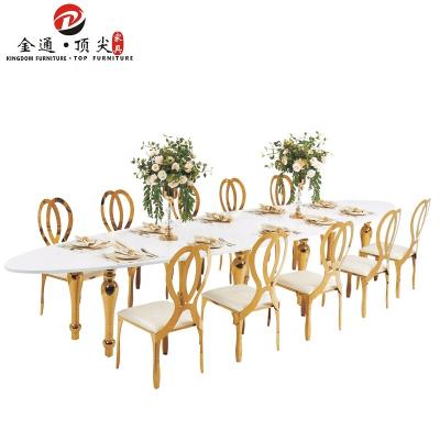 China Luxury Dining Table Traditional Wedding Gold Stainless Steel Table MDF Throne Oval Shaped Furniture for sale